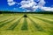 Aerial view of Tractor mowing green field in Finland