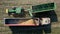 Aerial view of a tractor offloading wheat to truck