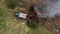 Aerial view tractor push the tree for burn