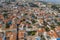 Aerial view of traditional mountain Cyprus village Pano Lefkara with red and orange roofs of buildings, drone photo