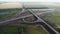 Aerial view of the traffic intersection. Transport interchange of highways. Road under construction. Beautiful panorama