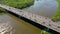 Aerial view of traffic moving on a massive bridge over the Vistula River in Warsaw. Highway passes through the river and leads to