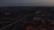 Aerial view of train arriving to train station. Traffic at railway tracks. City before sunrise. Berlin, Germany