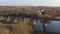 Aerial view of a train traveling over a railway bridge over a river