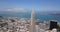 Aerial view of Trans America Tower with ocean and treasure island in background