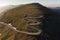 Aerial view of Transalpina mountain road at sunrise