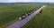 Aerial view. Transportation of combines on road tractors on the road. Oversized transportation. 4k