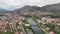 Aerial view Trebinje Bosnia Herzegovina. River and historical bridge. Old town in Europe with mountains and a house around big riv