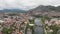 Aerial view Trebinje Bosnia Herzegovina. River and historical bridge. Old town in Europe with mountains and a house around big riv