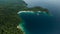 Aerial View Of Triton Bay, Raja Ampat Islands: Boat In Lagoon With Turquoise Water And Green Tropical Trees. Wide Angle Nature