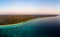 Aerial view tropical beach island reef caribbean sea at sunset. Kei Island, Indonesia Moluccas archipelago. Top travel destination