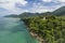 Aerial view of tropical coastline on Koh Chang, Thailand with temple, mountains,jungle and ocean