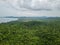 Aerial view of tropical island jungle with palms and emerald clear water