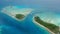 Aerial view tropical islet with lagoon and channel