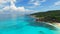 Aerial view of tropical paradise beach, white sand and turquoise sea water of Indian Ocean - Grand Anse, La Digue Island, Seychell