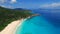 Aerial view of tropical paradise beach with white sand and turquoise water - Grand Anse, La Digue Island, Seychelles.