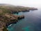 Aerial view of tropical Pasih Uug Broken beach cliff cove bay natural bridge Nusa Penida Bali Indonesia