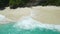 Aerial View of Tropical Sea Waves Crushing on Pristine White Sand Beach