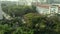 Aerial view of tropical village, city. Top view shot. Swimming Pools surrounding palms and green garden in the beautiful tropical