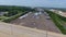 Aerial view of truck parking. Shooting with drone the landscape of the truck parking moving over the highway.