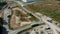 Aerial view of a truck with a trailer leaving the port.