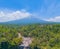 Aerial view of Tumpak Sewu Waterfall and Semeru mountain in Java, Indonesia