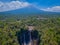 Aerial view of Tumpak Sewu Waterfall and Semeru mountain in Java, Indonesia