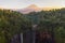 Aerial view of Tumpak Sewu waterfall and Semeru mountain at sunrise located in east java, Lumajang, Indonesia. Natural landscape