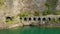 Aerial view of tunnel Grumo with arches in a rock near Como Lake. Cars moving in tunnel, near Olcio, Italy