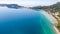 Aerial view on turqouise blue water and sandy beach of Limni Vouliagmeni or Ireon Lake, Peloponnese, Greece