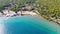 Aerial view of turquoise clear water and sandy beach of Ireon or Limni Vouliagmeni Lake in Peloponnese, Greece