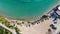 Aerial view of turquoise clear water and sandy beach of Ireon or Limni Vouliagmeni Lake in Peloponnese, Greece