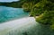 Aerial view of turquoise coastal water and sandy bank in El Nido archipelago tourist destination island hopping, Snake