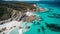 Aerial view of turquoise coastline, cliff, sand, and water generated by AI