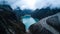 Aerial view on turquoise water lake Paron surrounded by mountains in Huaraz