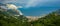 Aerial view from Turunc Bay, with sunbeam and cloudy sky. Marmaris, Turkey. Holiday and summer background. Curvy road and forest