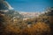 Aerial view from Turunc Bay, with sunbeam and cloudy sky. Marmaris, Turkey. Holiday and summer background. Curvy road and forest