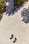 Aerial view of two male tourists walking on sand dune in Dueodde, Bornholm island, Denmark