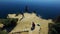 AERIAL VIEW. Two Tourists Taking Photos On Cape Fiolent Cliff