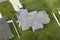 Aerial view of typical contemporary american private house with roof top covered with asphalt shingles and green lawn on