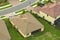 Aerial view of typical contemporary american private house with roof top covered with ceramic shingles and double garage