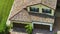 Aerial view of typical contemporary american private house with roof top covered with ceramic shingles and double garage