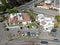 Aerial view of typical small town shopping center with supermarket, bank, restaurant and parking