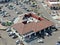 Aerial view of typical small town shopping center with supermarket, bank, restaurant and parking