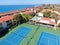 Aerial view of typical south california community condo with tennis court