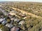 Aerial view typical Texas residential neighborhood in autumn wit