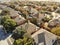 Aerial view typical Texas residential neighborhood in autumn wit