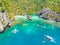 Aerial view of Ubugon Cove on paradise Cadlao island with sharp limestone rocks, tropical travel destination - El Nido, Palawan,