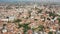 Aerial view of Udine cityscape overlooking residential areas and ossuary temple of Fallen of Italy (Tempio