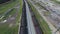 Aerial view UHD 4K of freight train with wagons and standing train with coal